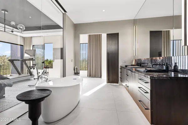 a bathroom with a granite countertop sink a toilet and shower