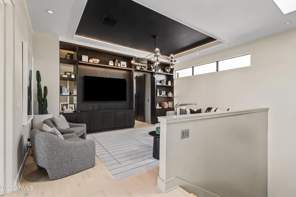 a bedroom with a large bed and a flat screen tv