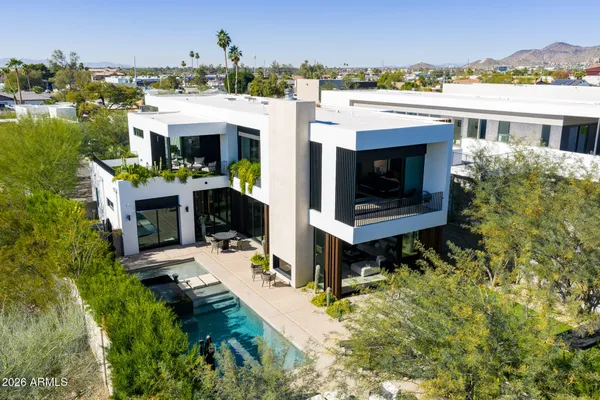 a view of a swimming pool with a patio