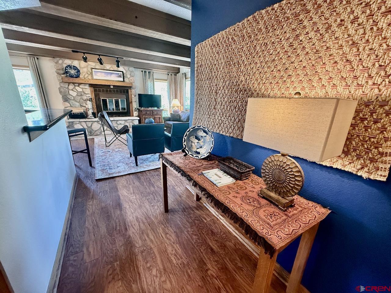 11 Snowmass Road, Unit 337 Crested Butte, CO 81225 - Photo 16 of 35 a living room with furniture and a wooden floor