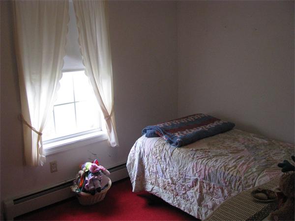 157 Hardwick Road Barre, MA 01005 - Photo 7 of 8 a bedroom with a bed and a window