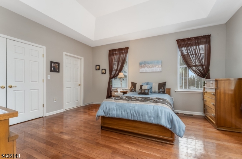 107 Samson Drive Flemington, NJ 08822 - Photo 13 of 29 a bedroom with a bed and wooden floor
