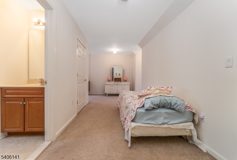 107 Samson Drive Flemington, NJ 08822 - Photo 18 of 29 a bedroom with a bed and a cabinets