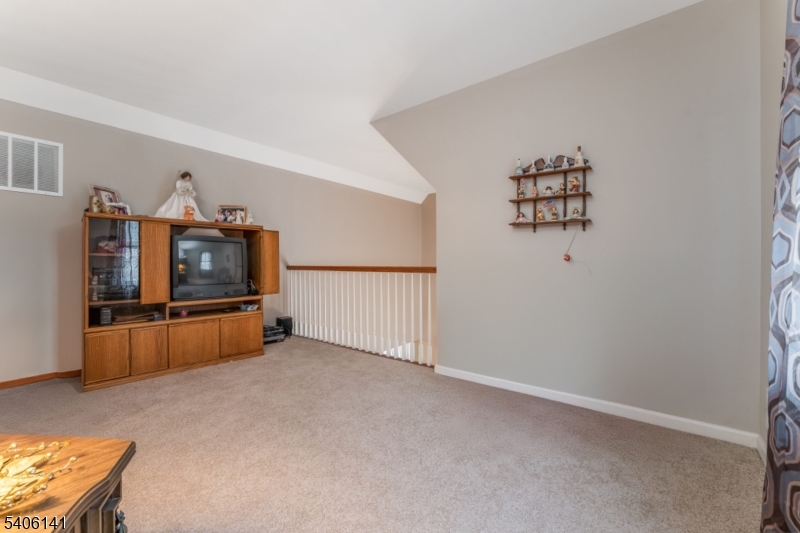 107 Samson Drive Flemington, NJ 08822 - Photo 19 of 29 an empty room with windows and cabinet