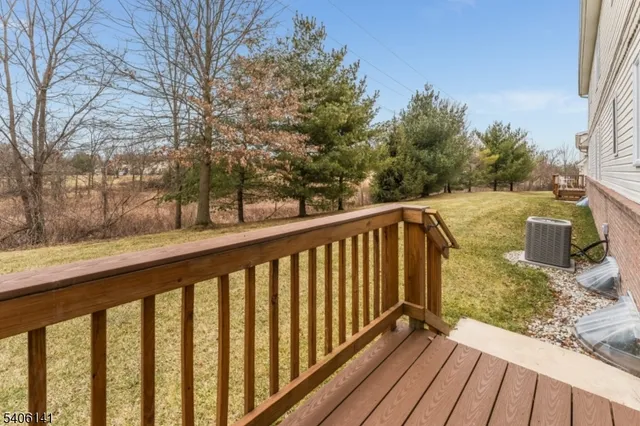a view of a balcony with wooden fence