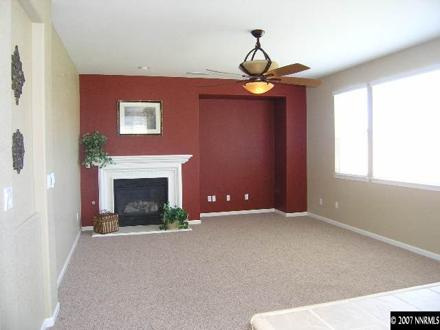 10613 Fire Poppy Circle Reno, NV 89521 - Photo 3 of 4 a view of an empty room with window and fire place