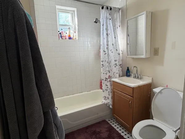 a bathroom with a sink a toilet and a bathtub