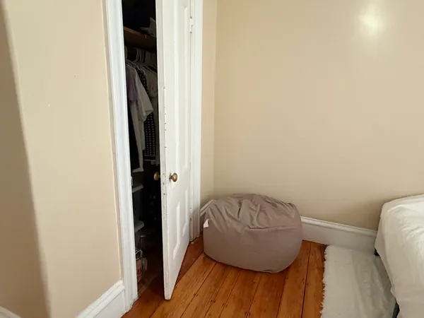 a room with a chair and a wooden floor