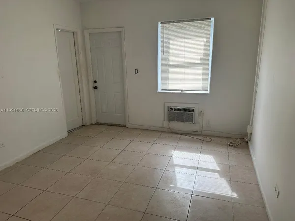 a bathroom with a toilet sink and shower