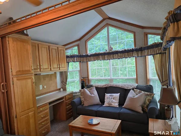 a living room with furniture and a window