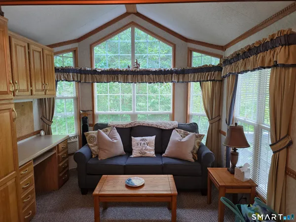 a living room with furniture and a window
