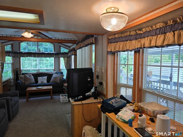 a bedroom with furniture and a window