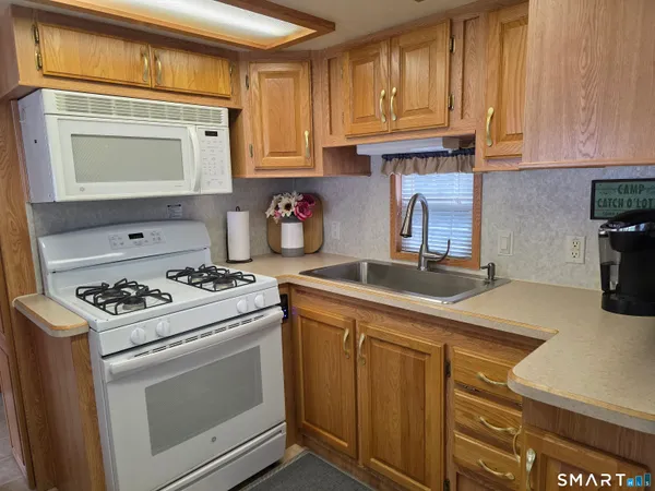 a outdoor living space with furniture and a potted plant