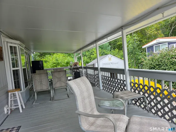 a view of a chairs and table in the patio