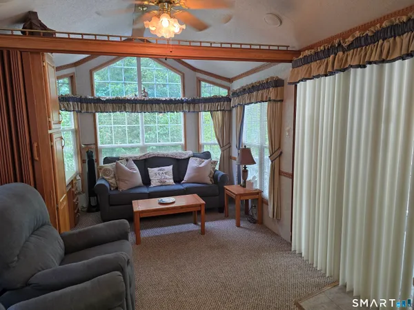 a living room with furniture and a window