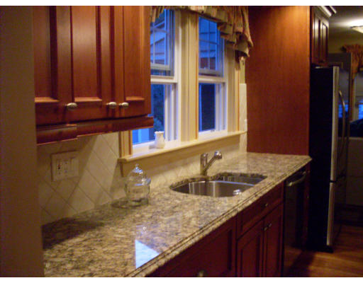 12 Brae Burn Road Milton, MA 02186 - Photo 1 of 18 a bathroom with a granite countertop sink and a mirror