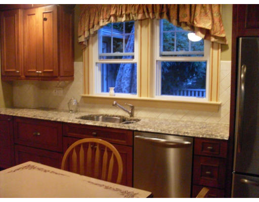12 Brae Burn Road Milton, MA 02186 - Photo 2 of 18 a kitchen with granite countertop a sink and cabinets