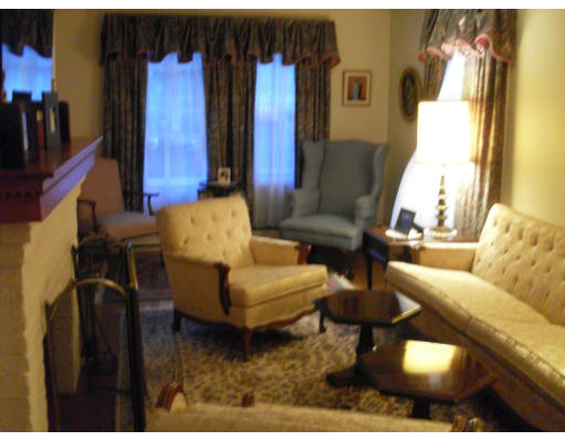 12 Brae Burn Road Milton, MA 02186 - Photo 6 of 18 a living room with furniture and a painting on the wall