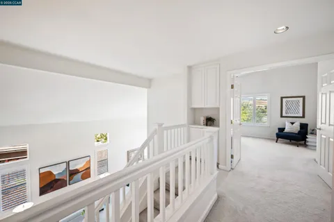 a view of an empty room with furniture and baby crib
