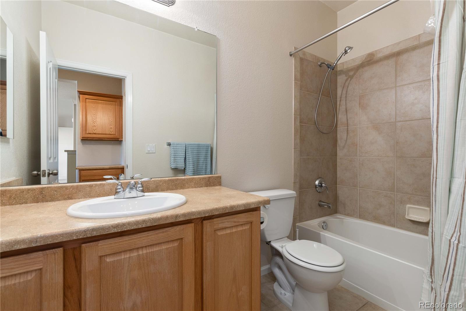3454 Cascina Place, Unit D Highlands Ranch, CO 80126 - Photo 13 of 31 a bathroom with a sink a toilet and shower
