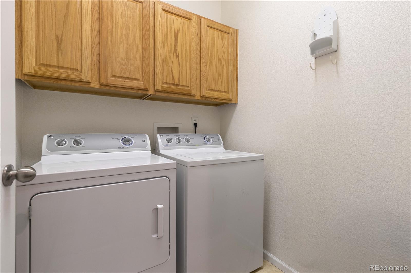 3454 Cascina Place, Unit D Highlands Ranch, CO 80126 - Photo 14 of 31 a utility room with dryer and washer
