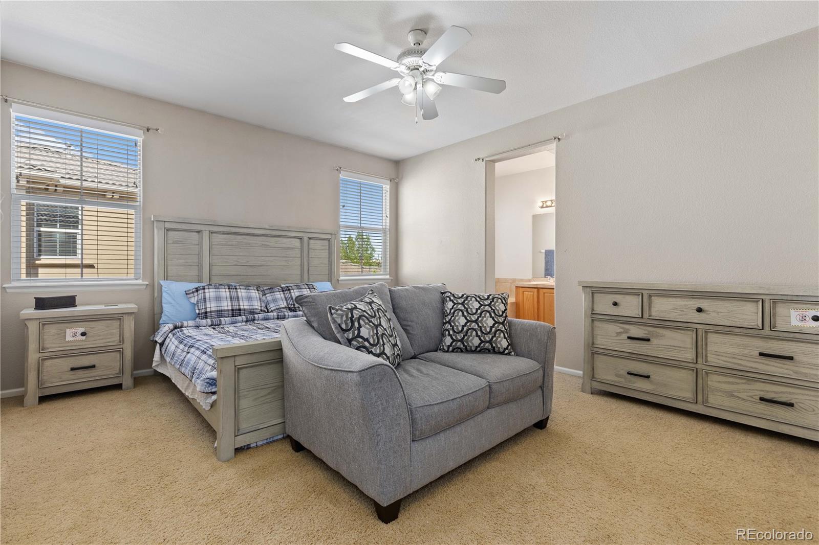 3454 Cascina Place, Unit D Highlands Ranch, CO 80126 - Photo 17 of 31 a living room with furniture and a window