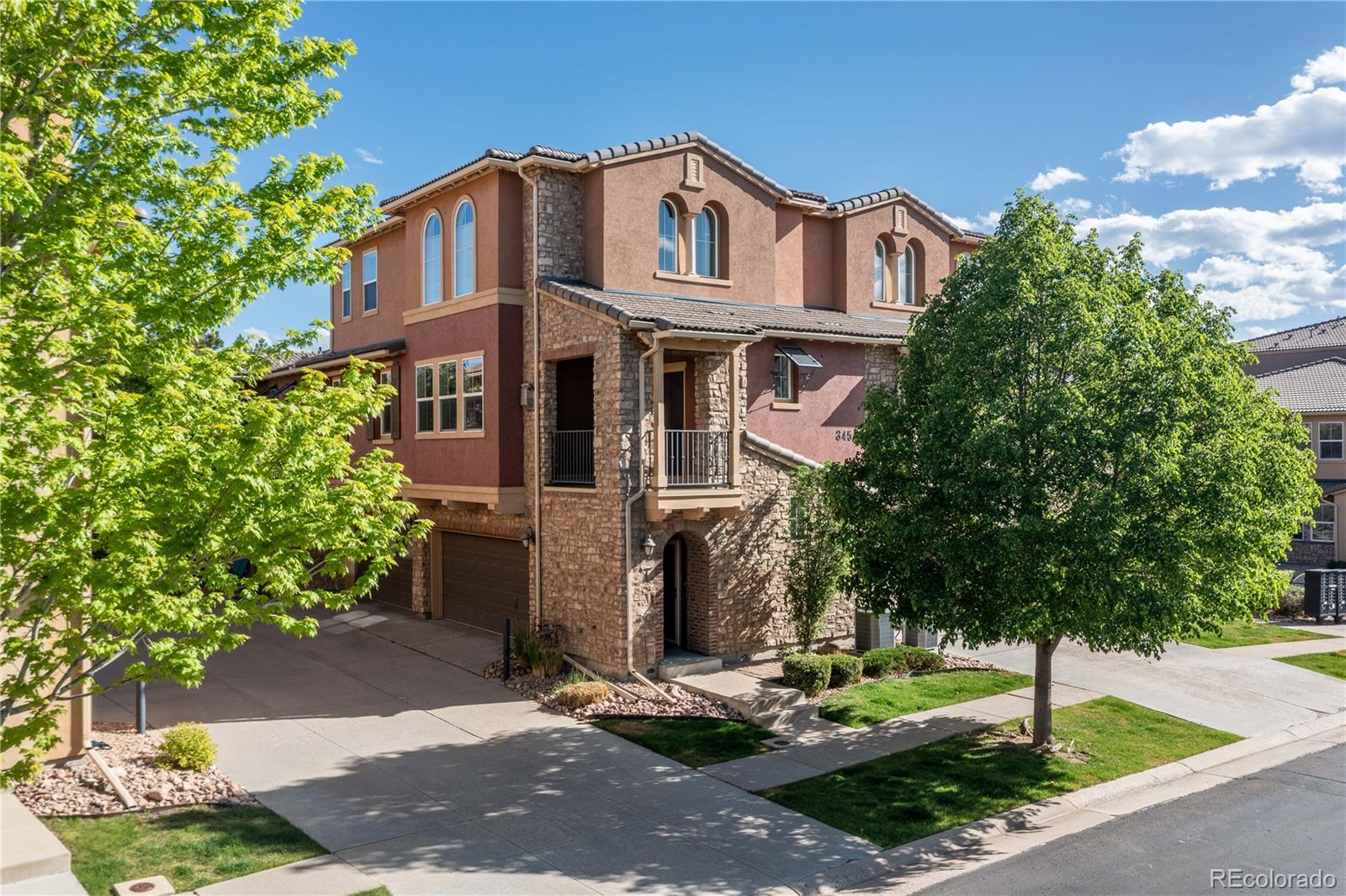3454 Cascina Place, Unit D Highlands Ranch, CO 80126 - Photo 2 of 31 a front view of a house with garden