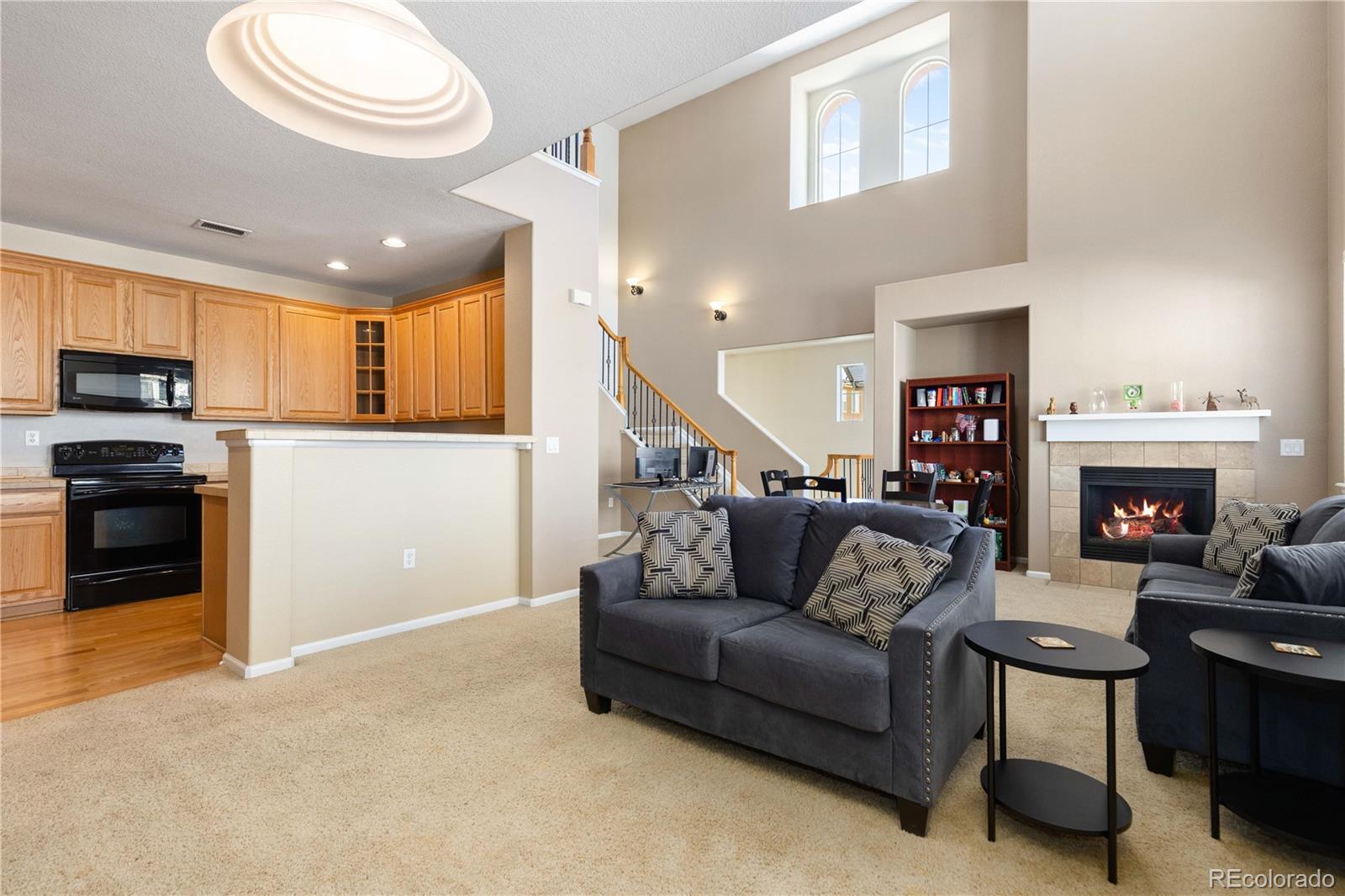 3454 Cascina Place, Unit D Highlands Ranch, CO 80126 - Photo 7 of 31 a living room with furniture and a fireplace