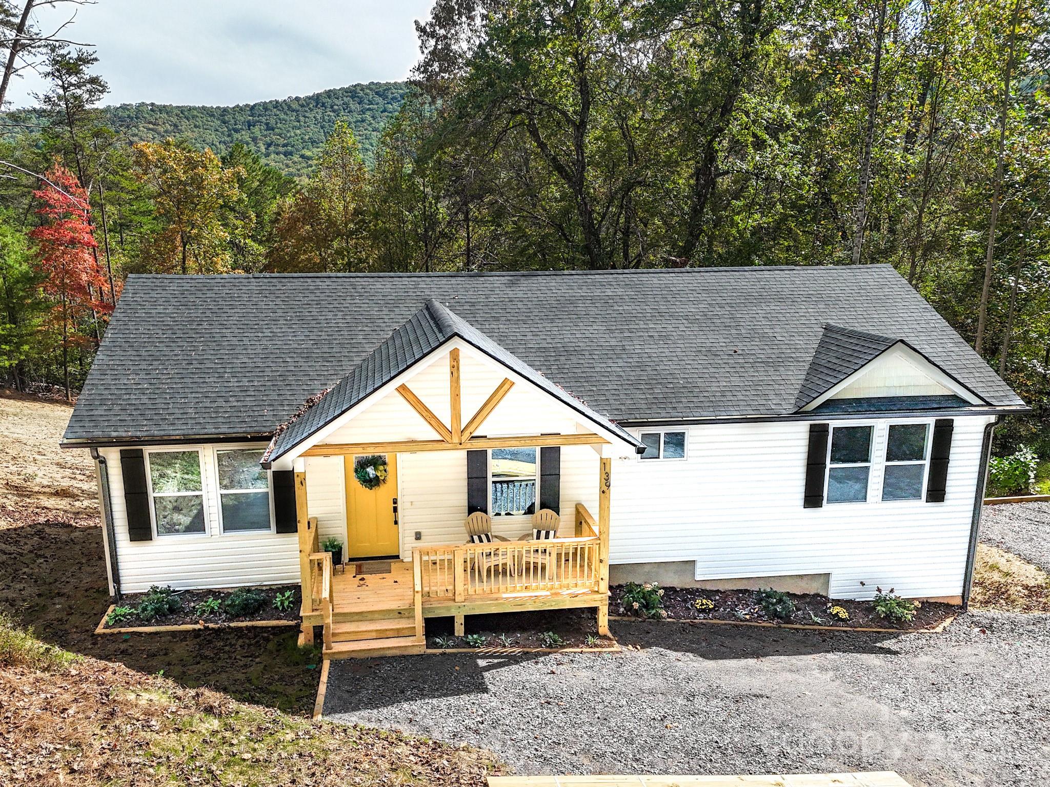 139 Burley Ridge Candler, NC 28715 - Photo 2 of 40 a house with trees in the background