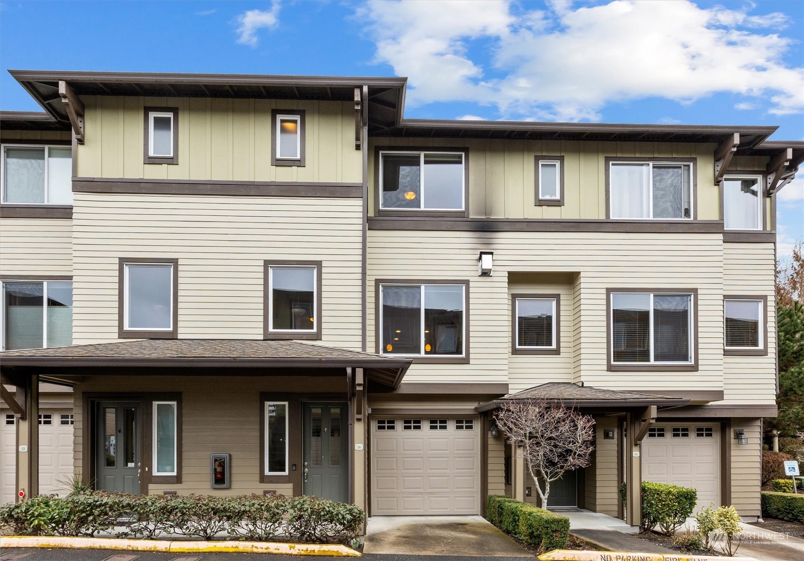 a front view of a house with many windows
