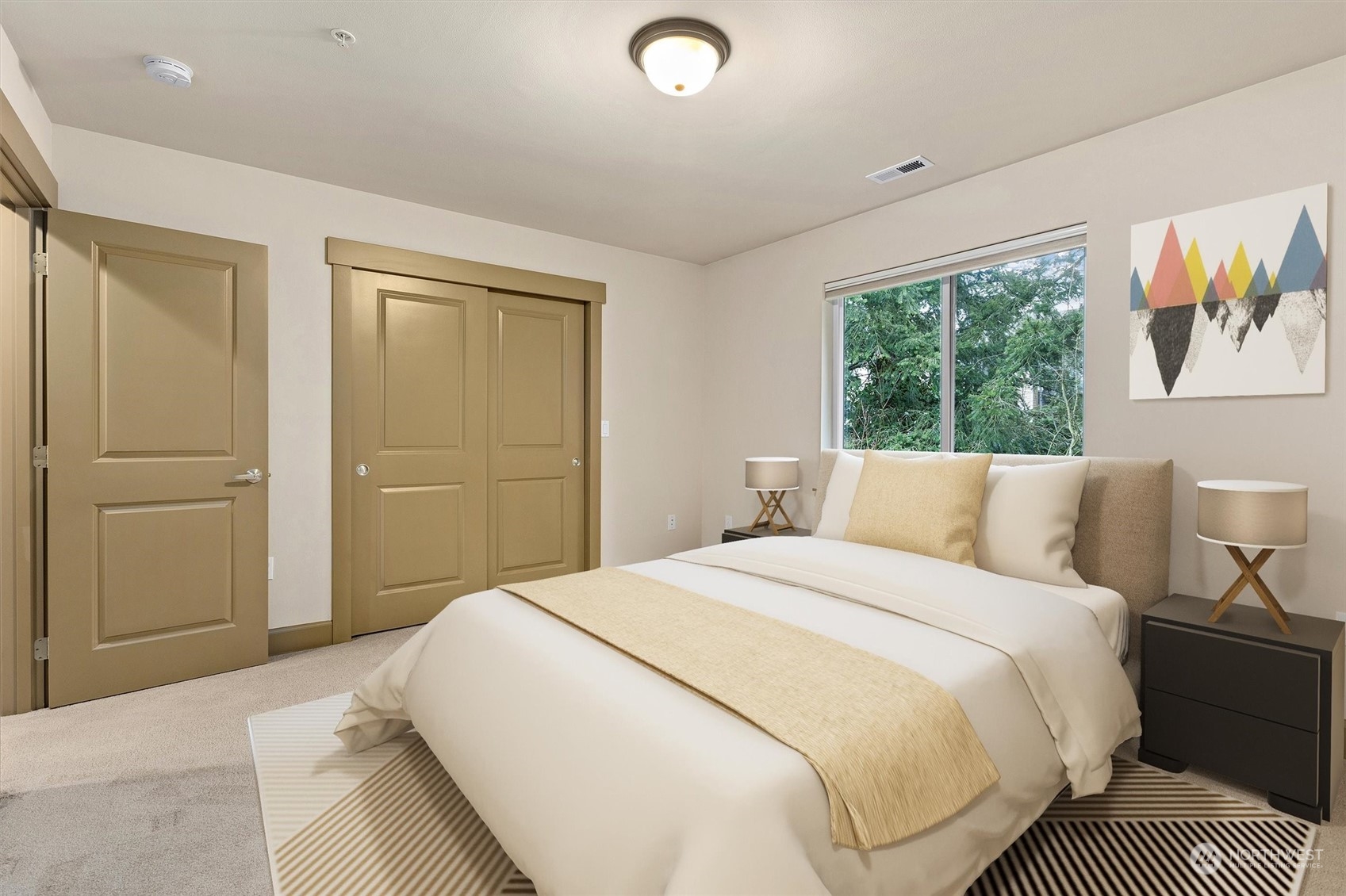 2115 201st Place Southeast, Unit I4 Bothell, WA 98012 - Photo 18 of 24 a bedroom with a large bed and a window