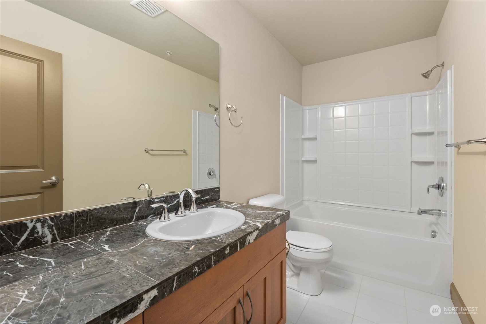 2115 201st Place Southeast, Unit I4 Bothell, WA 98012 - Photo 19 of 24 a bathroom with a granite countertop sink toilet and shower