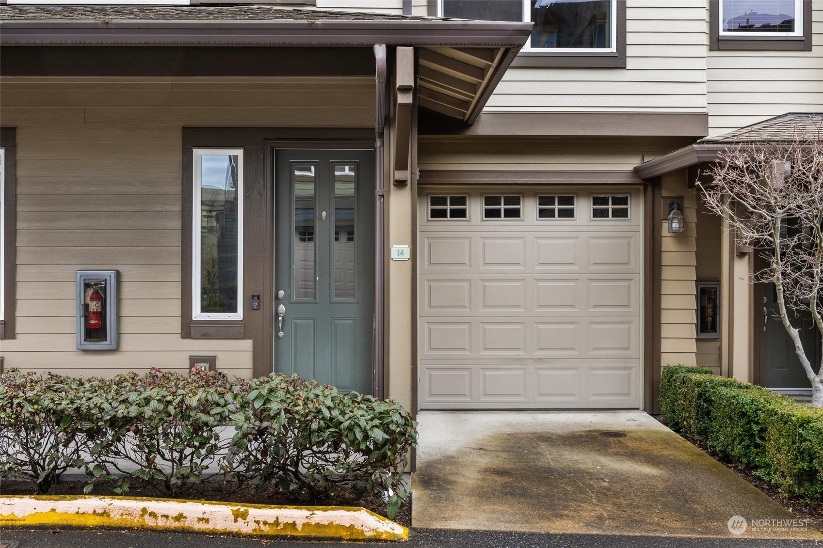 2115 201st Place Southeast, Unit I4 Bothell, WA 98012 - Photo 2 of 24 a front view of a house with a yard