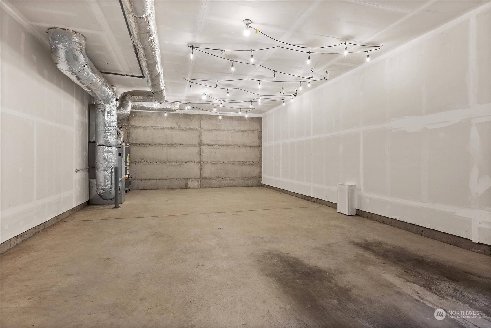 2115 201st Place Southeast, Unit I4 Bothell, WA 98012 - Photo 21 of 24 a view of a garage with white walls