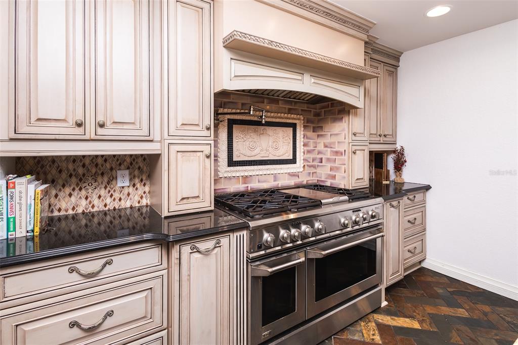1001 Nottingham Street Orlando, FL 32803 - Photo 8 of 49 a stove top oven sitting inside of a kitchen