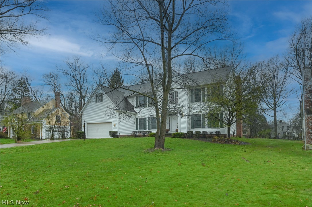1688 Sheridan Road South Euclid, OH 44121 - Photo 2 of 48 View of front of house with a front lawn and a garage