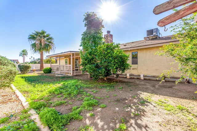 a view of a house with a tree