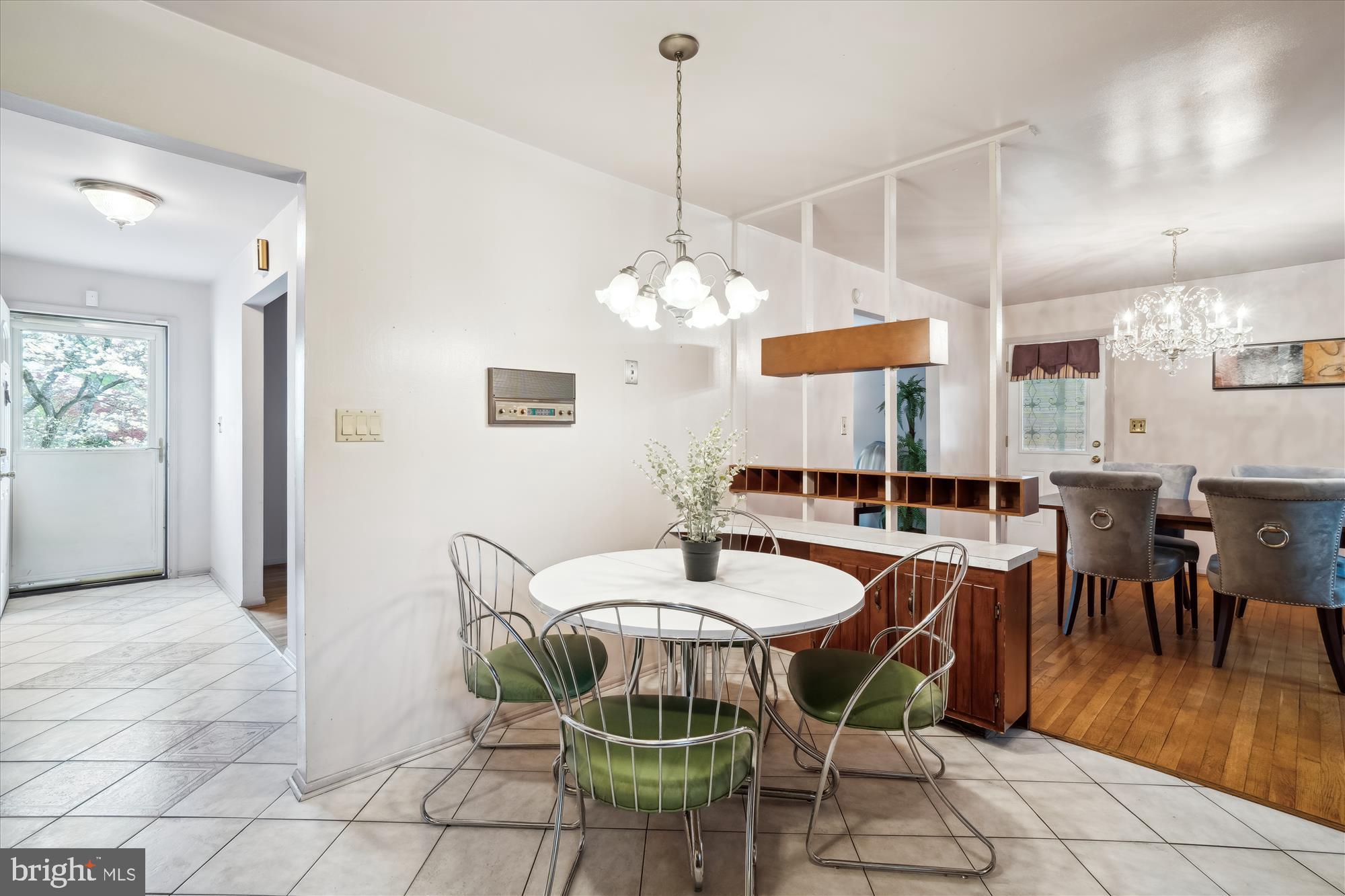 12103 Chesterton Drive Upper Marlboro, MD 20774 - Photo 15 of 30 a dining room with furniture a chandelier and wooden floor