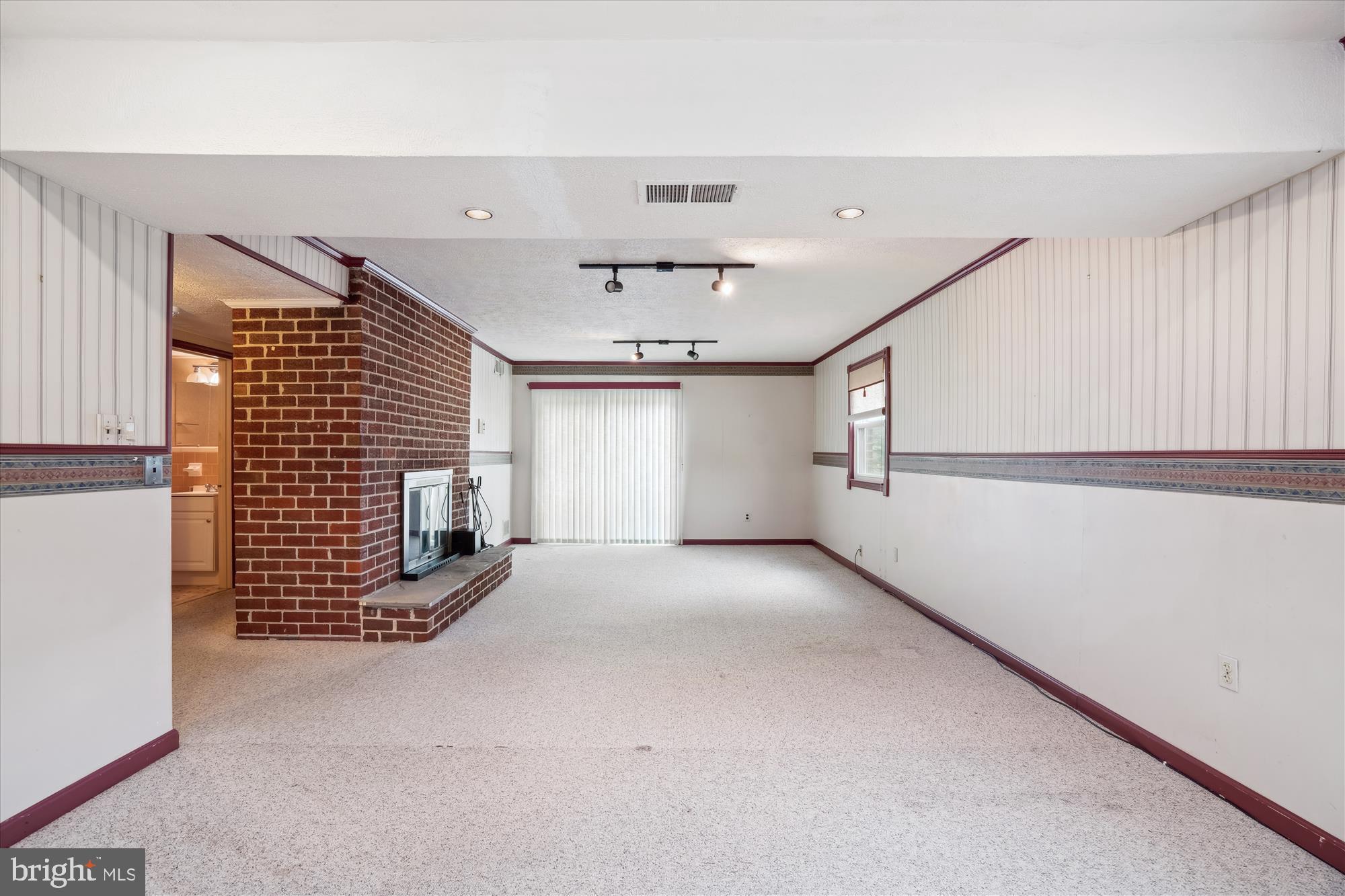 12103 Chesterton Drive Upper Marlboro, MD 20774 - Photo 20 of 30 a view of an empty room with a fireplace