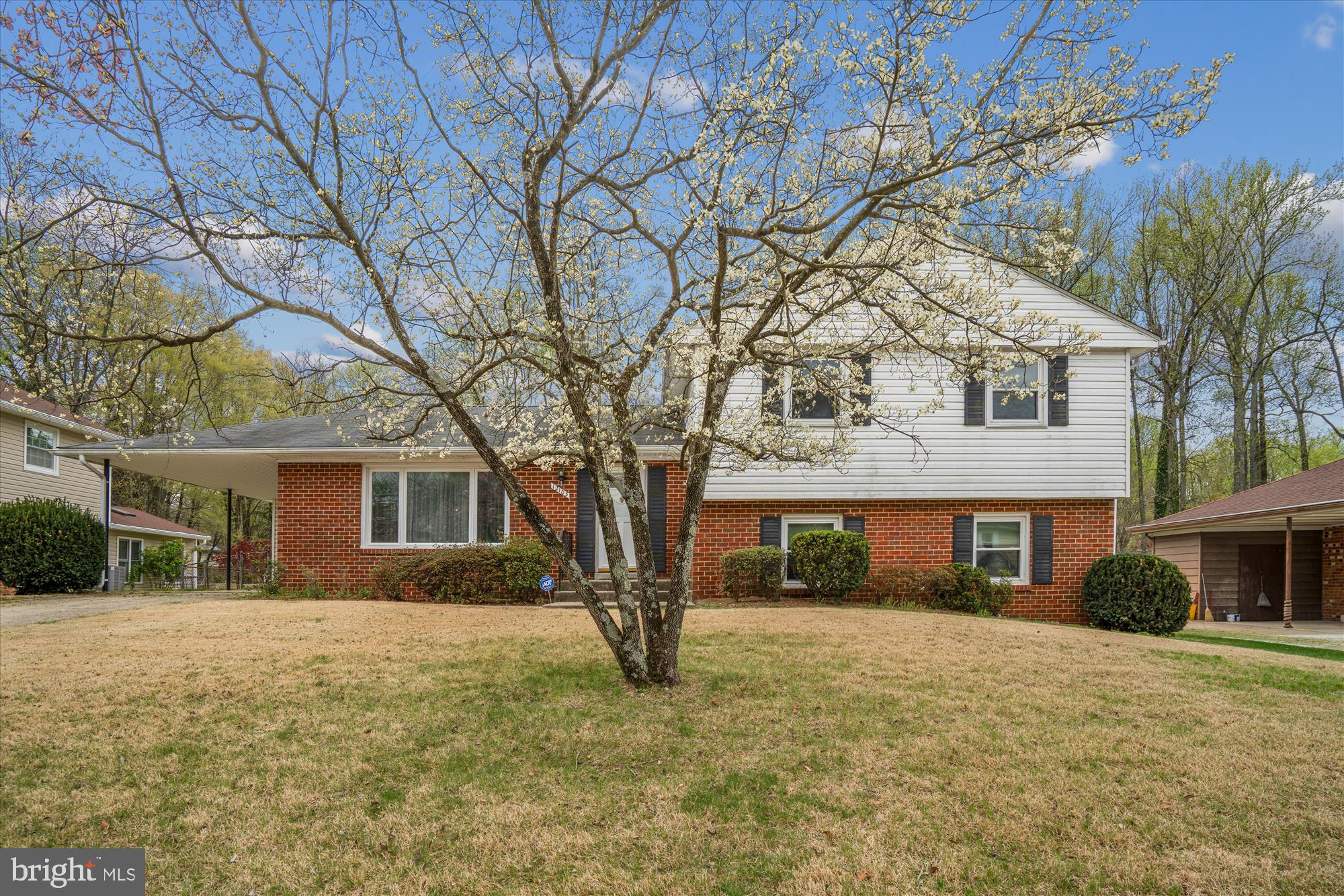 12103 Chesterton Drive Upper Marlboro, MD 20774 - Photo 27 of 30 a front view of a house with a yard and garage