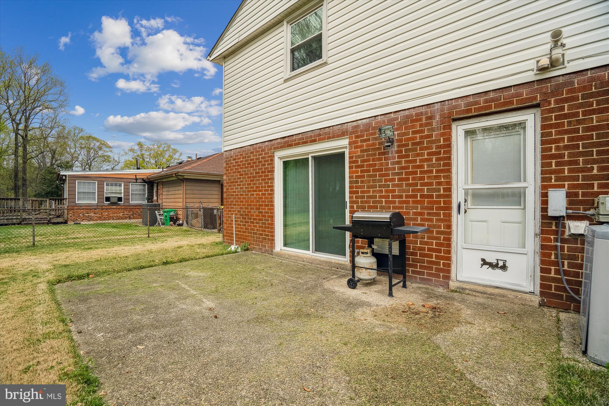 12103 Chesterton Drive Upper Marlboro, MD 20774 - Photo 5 of 30 a view of a house with a backyard and a table and chair