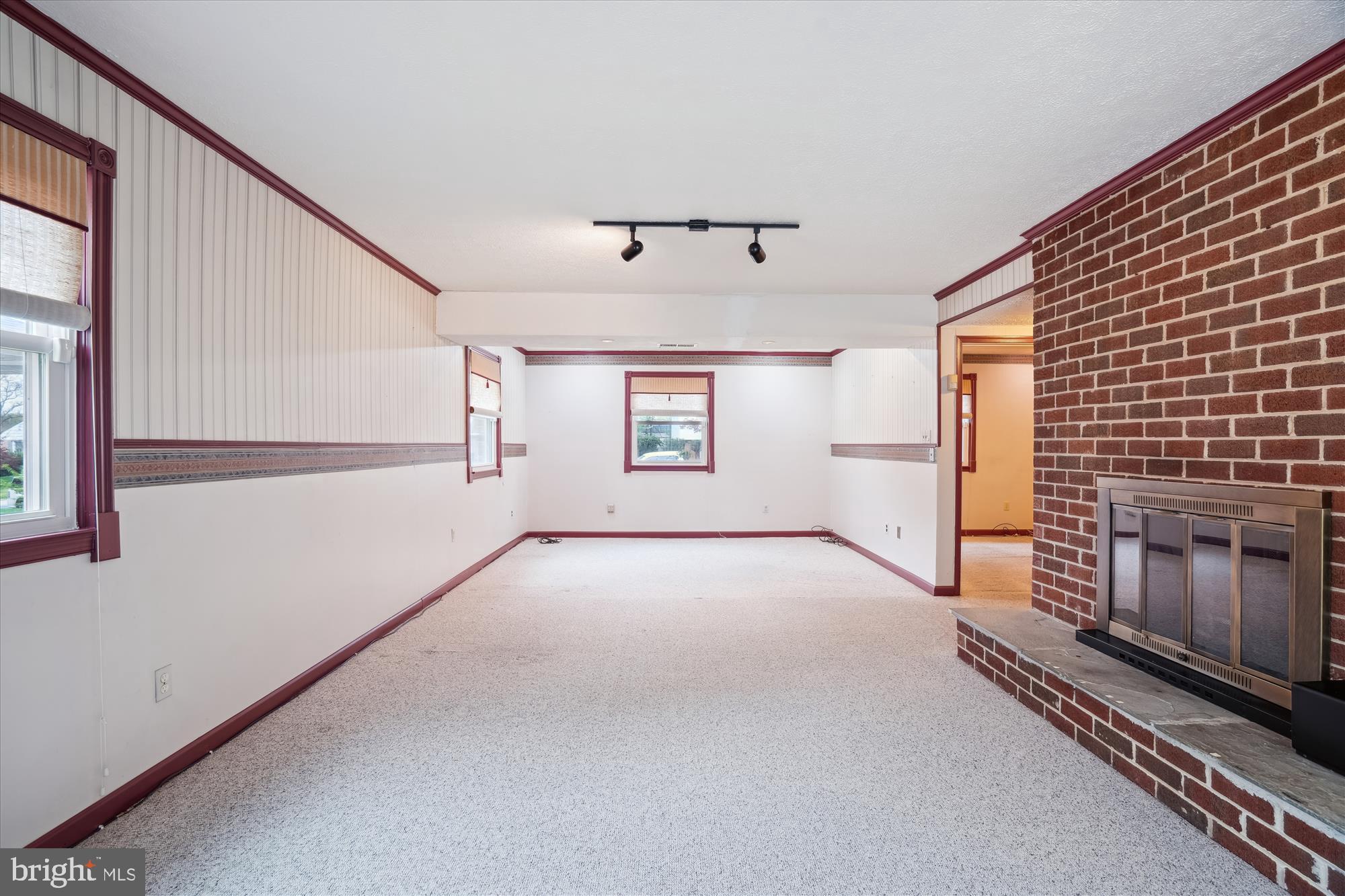 12103 Chesterton Drive Upper Marlboro, MD 20774 - Photo 7 of 30 a view of a livingroom with an empty space and a fireplace