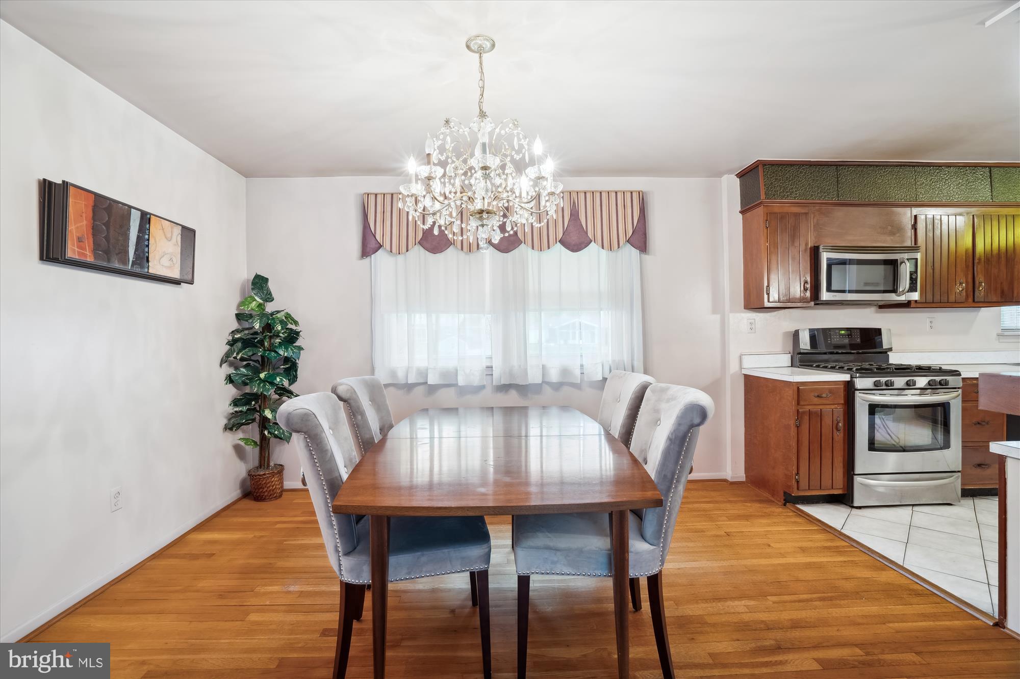 12103 Chesterton Drive Upper Marlboro, MD 20774 - Photo 9 of 30 a view of a dining room with furniture window and wooden floor