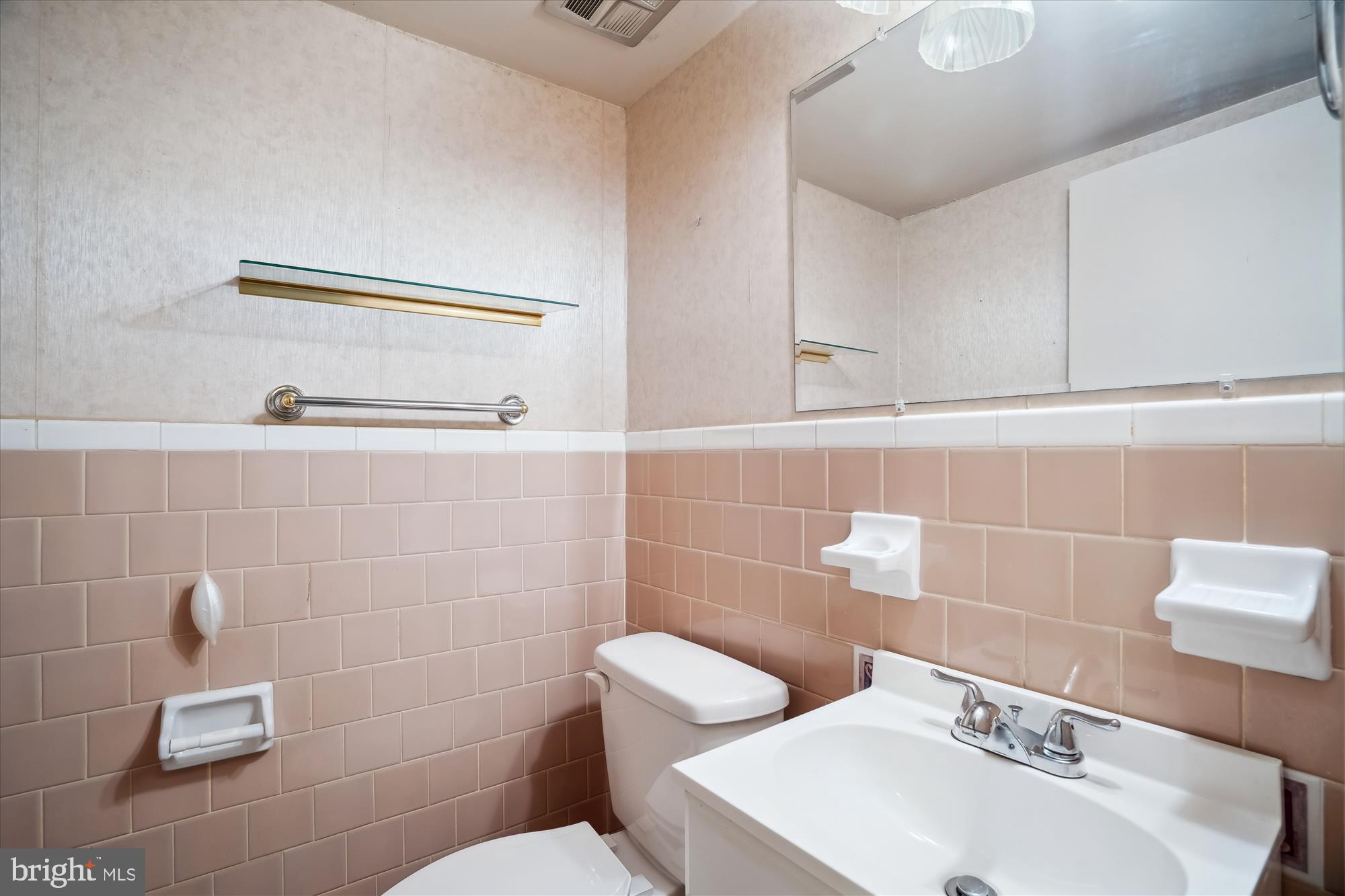 12103 Chesterton Drive Upper Marlboro, MD 20774 - Photo 10 of 30 a bathroom with a sink a toilet and a mirror