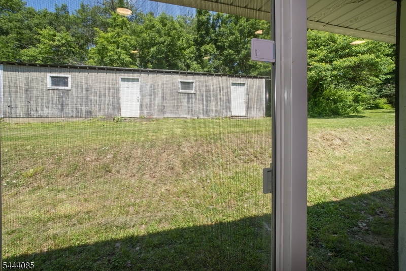 79 Lake Wallkill Road Vernon, NJ 07461 - Photo 26 of 27 a view of a backyard with a garden