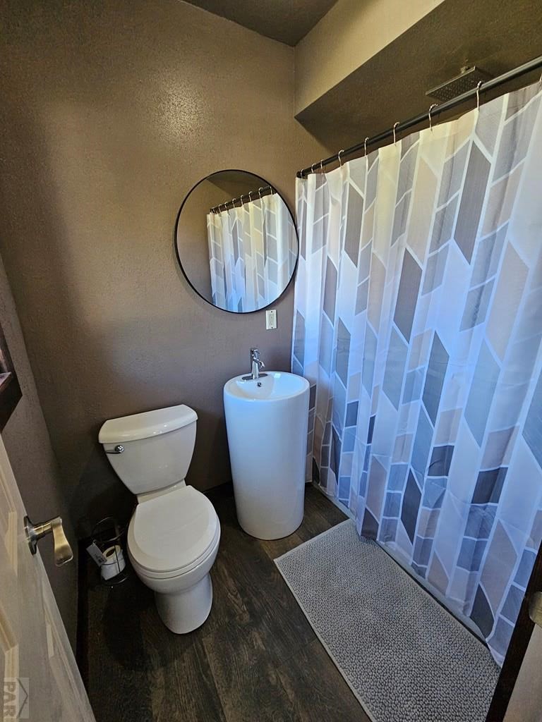 401 Park Street Springfield, CO 81073 - Photo 11 of 50 a bathroom with a toilet and a sink
