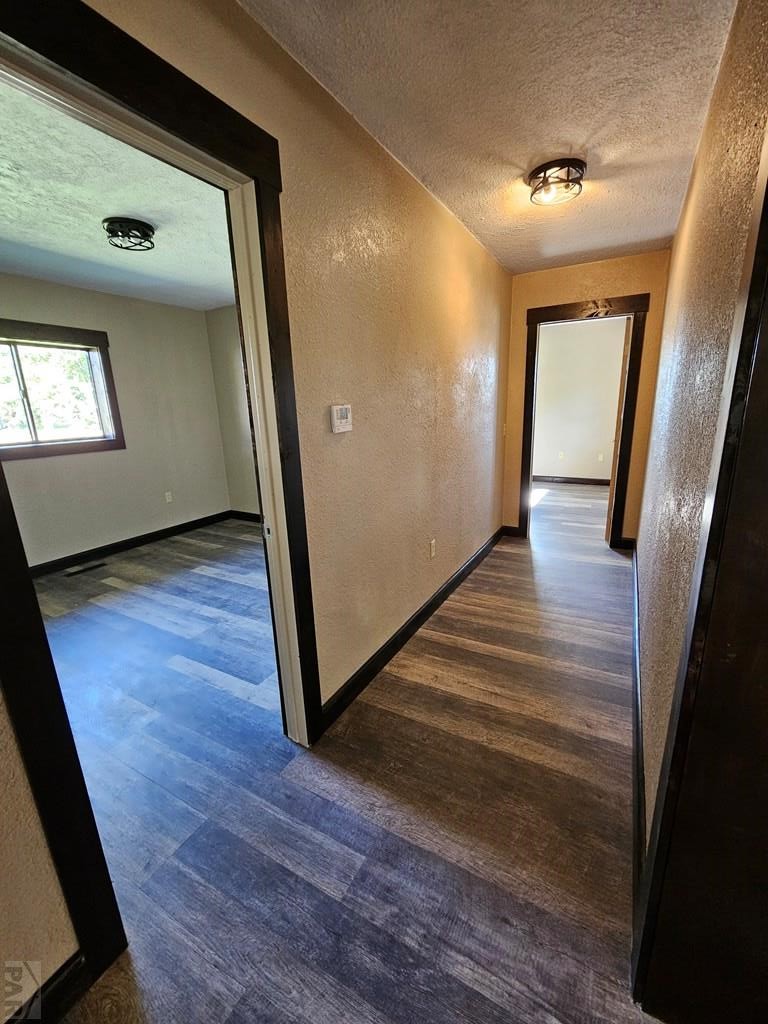 401 Park Street Springfield, CO 81073 - Photo 12 of 50 a view of a hallway with wooden floor