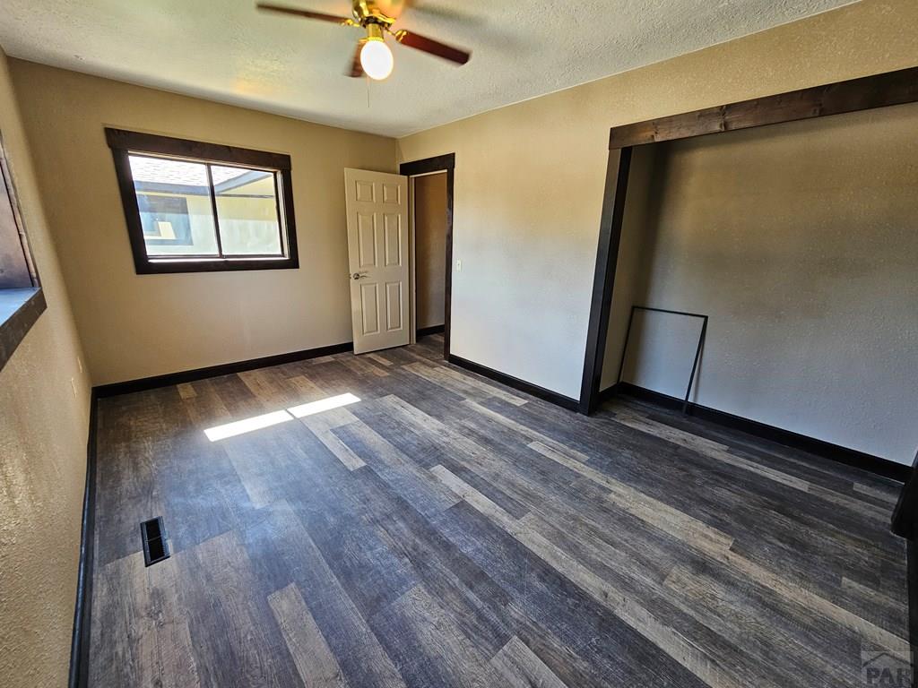 401 Park Street Springfield, CO 81073 - Photo 16 of 50 wooden floor in an empty room with a window