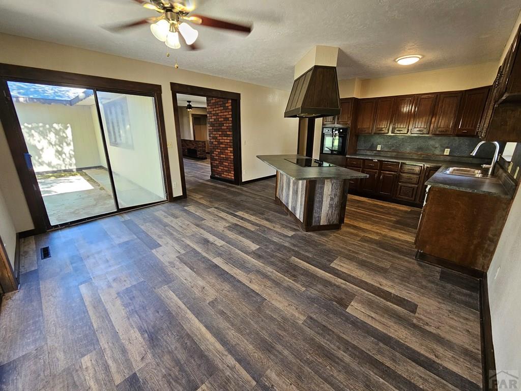 401 Park Street Springfield, CO 81073 - Photo 19 of 50 a view of a living room with furniture and a flat screen tv