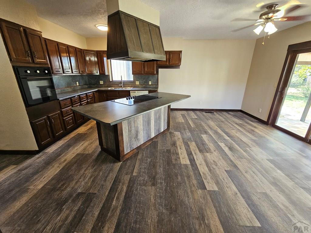 401 Park Street Springfield, CO 81073 - Photo 20 of 50 a kitchen with stainless steel appliances granite countertop a sink stove and refrigerator